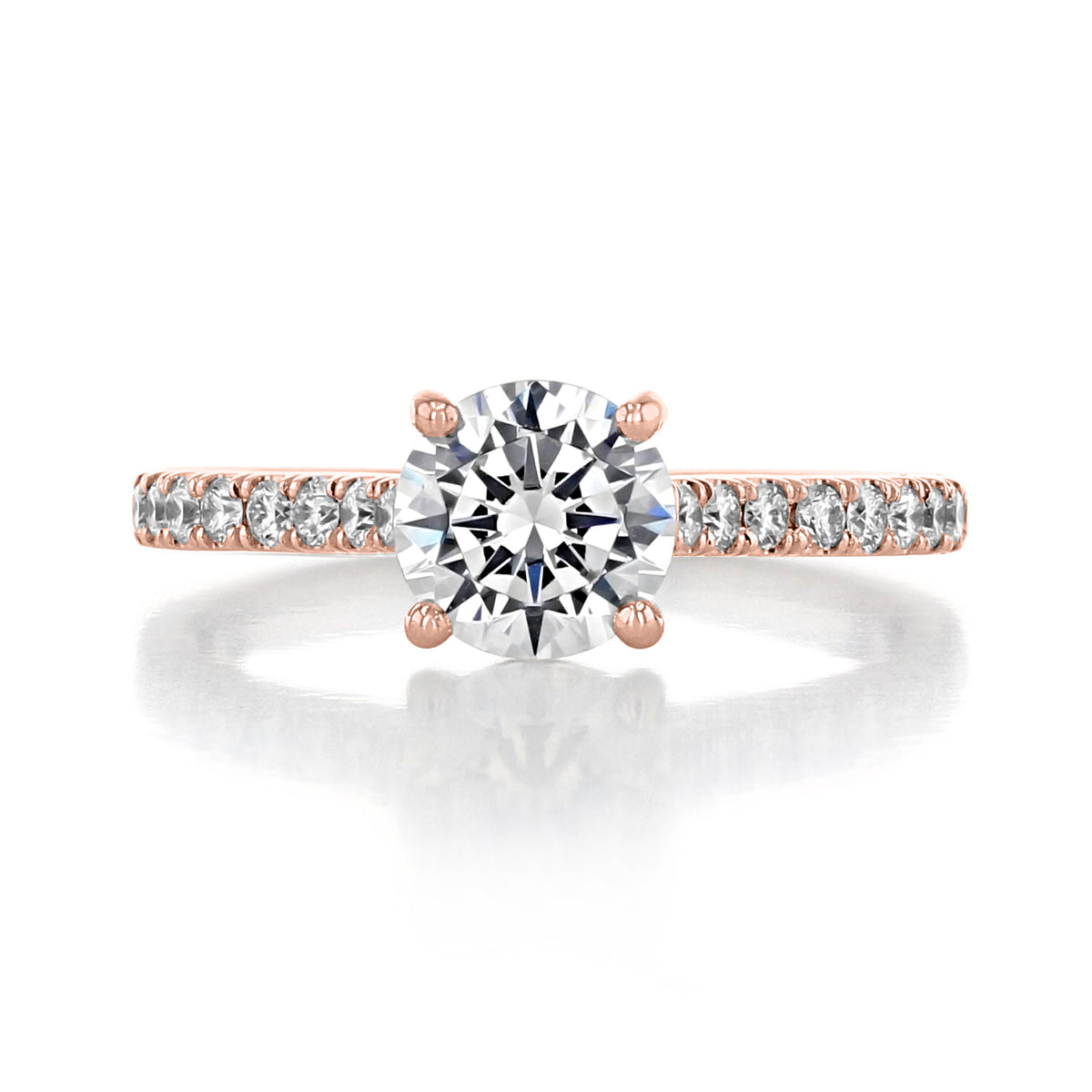 Geneva | Round Micro-Prong Engagement Ring featuring a round diamond on a rose gold band with a row of French pave set diamonds.
