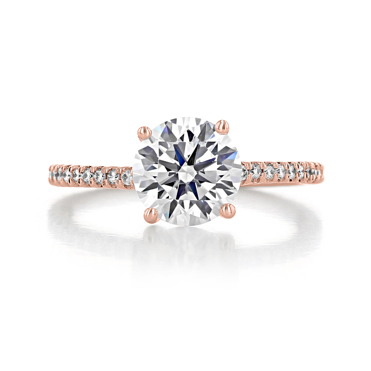 Sierra Round Micro-Prong Engagement Ring featuring a round diamond solitaire on a thin micro-prong band set with small diamonds.