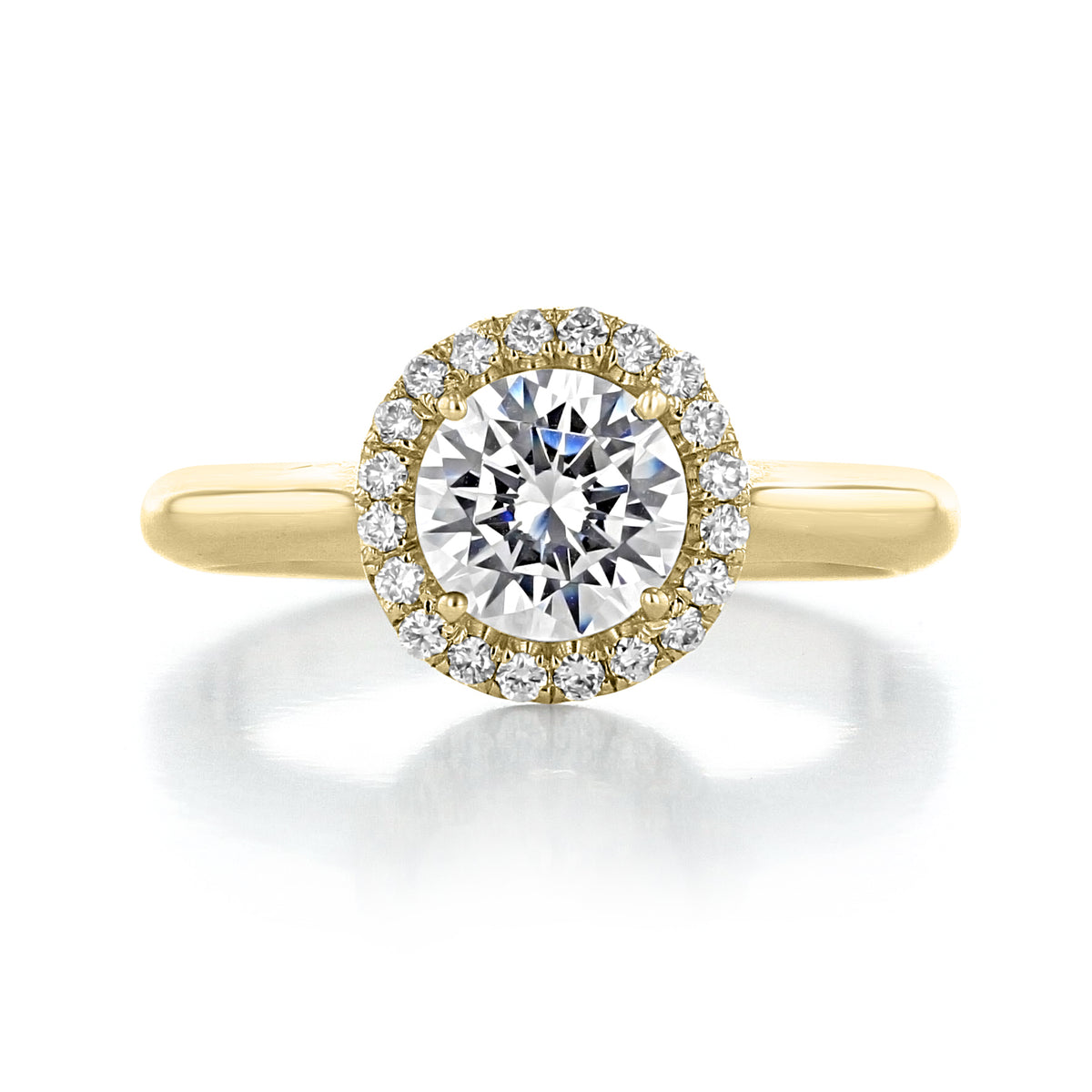 A yellow gold Danhov Classico | Halo Engagement Ring - CL102 featuring a round-cut center diamond surrounded by a halo of smaller diamonds.