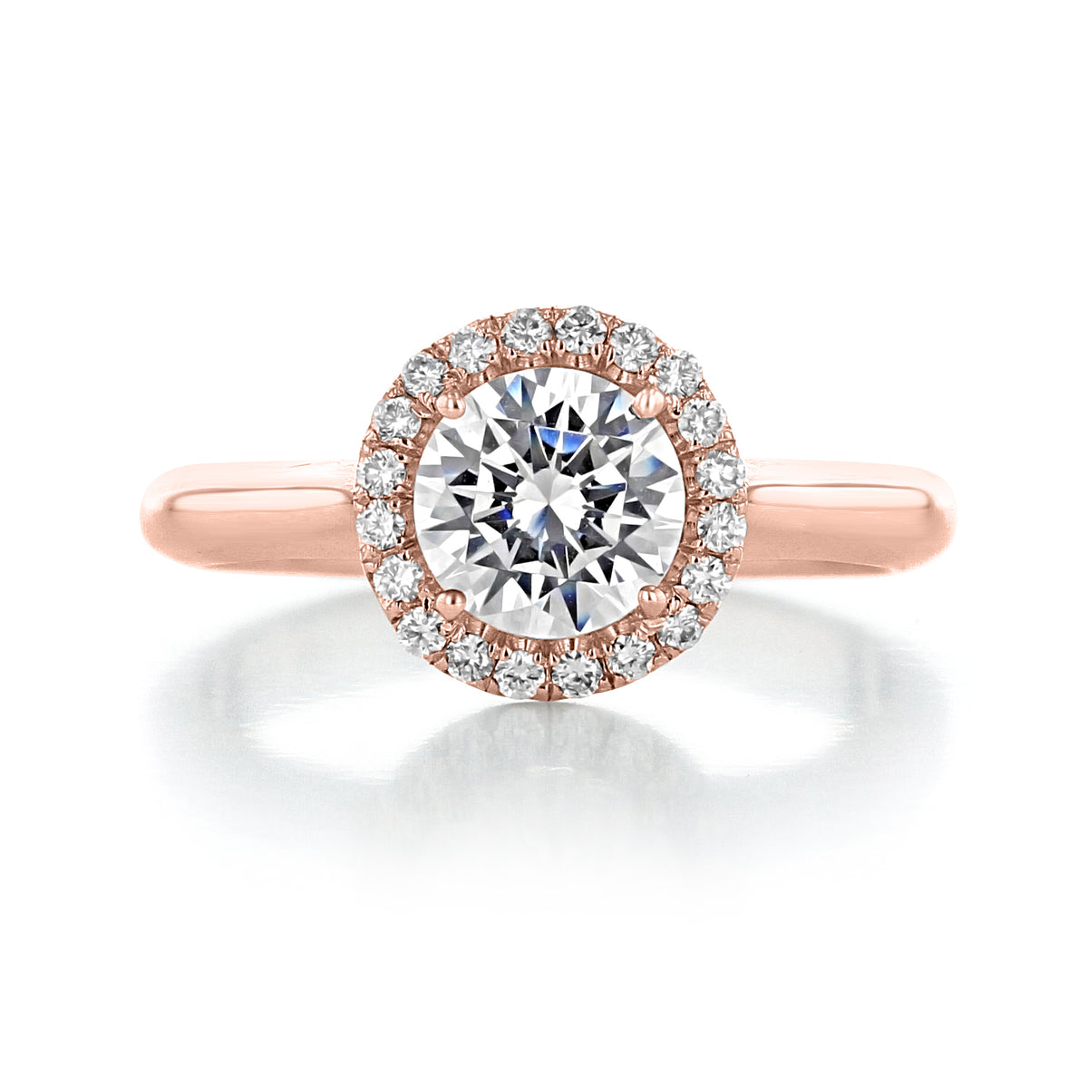 Rose gold Danhov Classico | Halo Engagement Ring - CL102 featuring a round center diamond surrounded by a halo of smaller pavé diamonds.