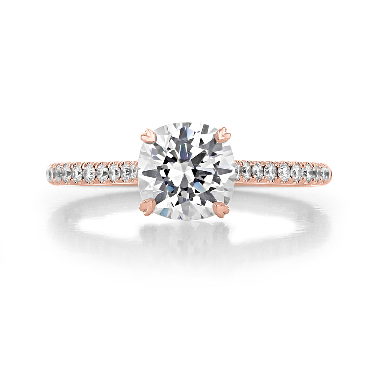 A round-cut center diamond set on a Danhov Classico | Micro-Prong Engagement Ring - CL138 in rose gold with pavé-set accent diamonds.