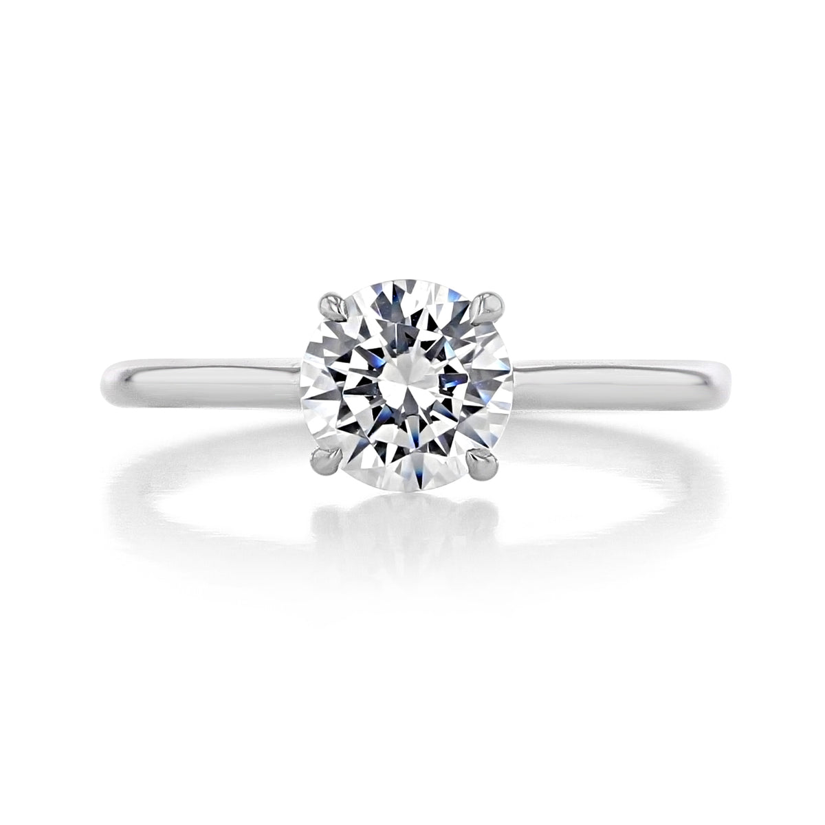 A Danhov Classico | Engagement Ring - CL141 solitaire featuring a round brilliant-cut diamond on a plain metal band with four prongs for a look of classic minimalism.
