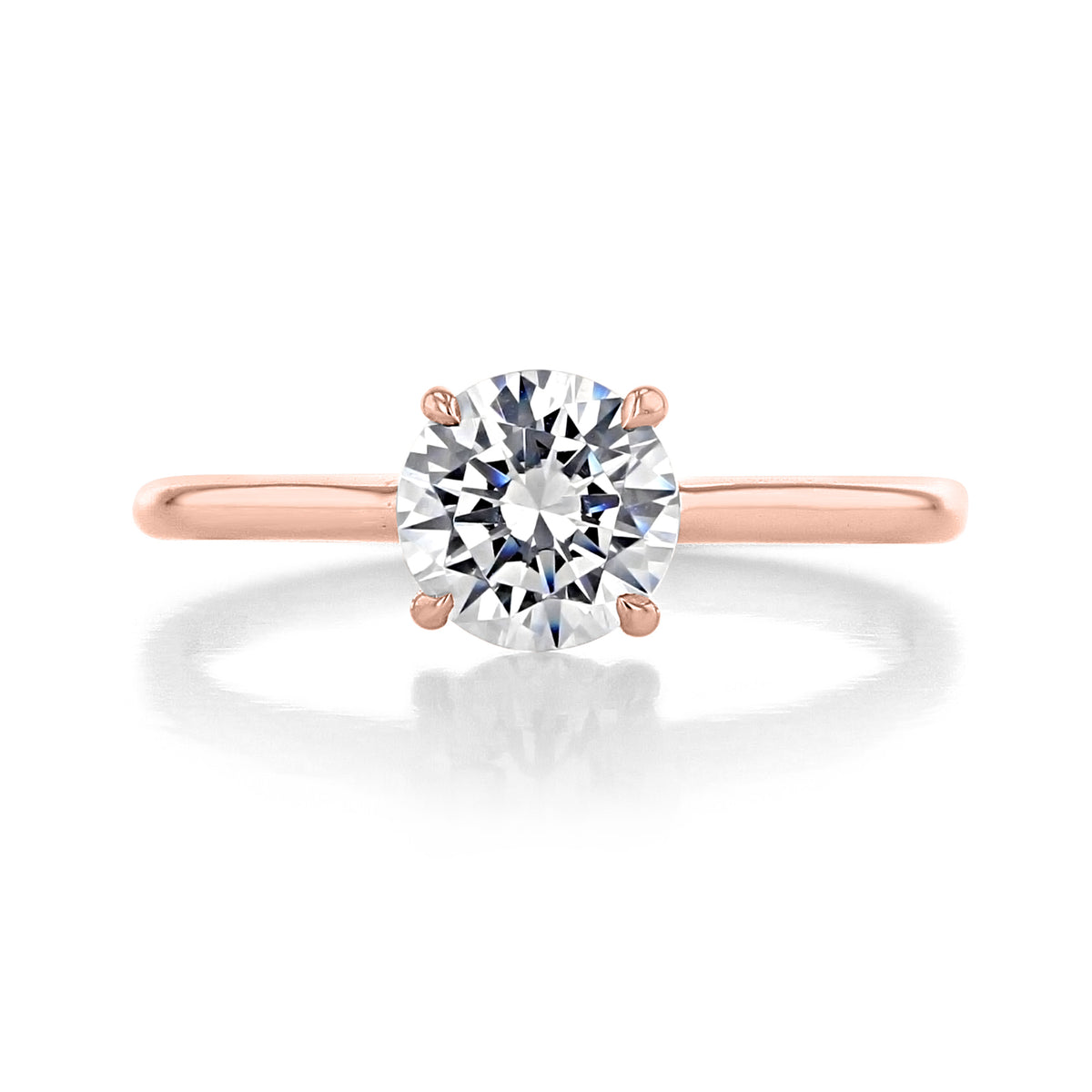 The Classico | Engagement Ring - CL141 featuring a minimalist round-cut diamond solitaire set on a rose gold band.