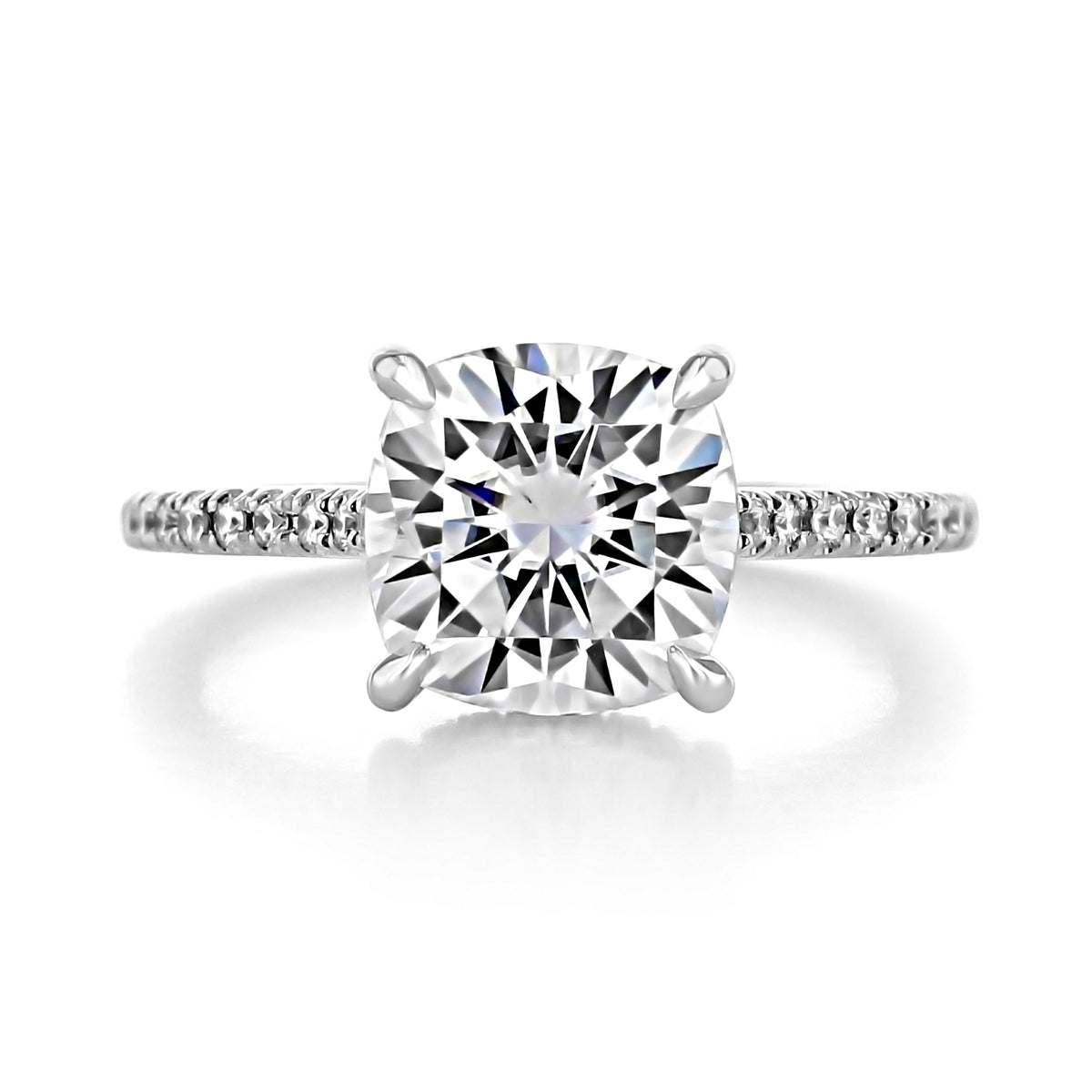 Delaney cushion-cut diamond engagement ring with a hidden halo and pavé band on a white background.
