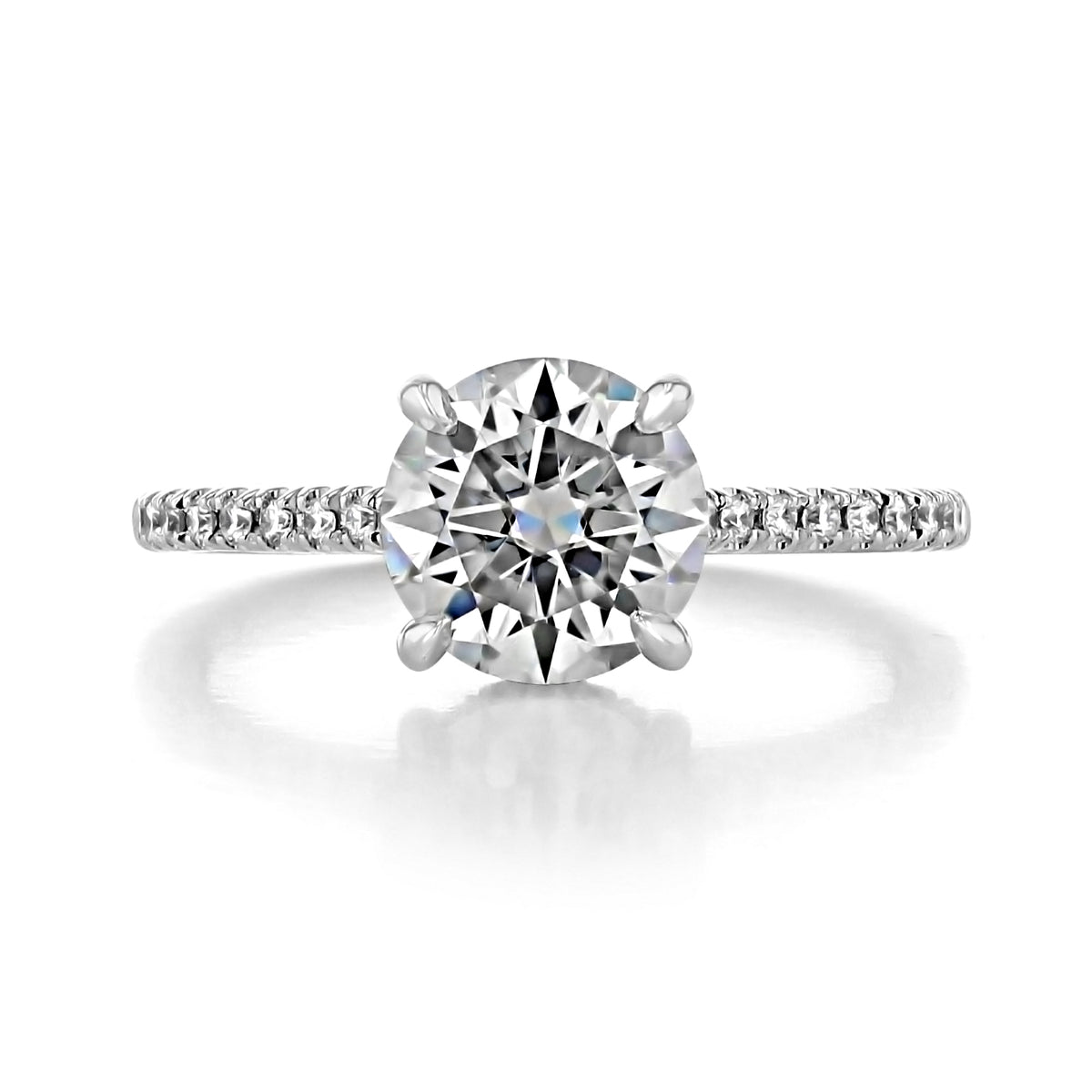 A round-cut Delaney | Round Hidden Halo Engagement Ring on a micro-prong pavé band.