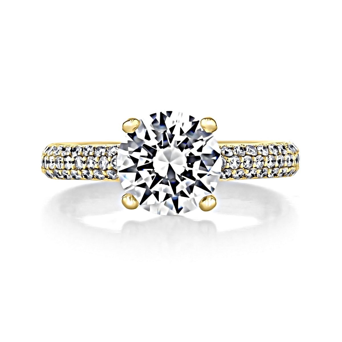 Elsa | Round Triple Pavé Engagement Ring featuring a round-cut solitaire on a gold band with three rows of pavé-set diamonds.