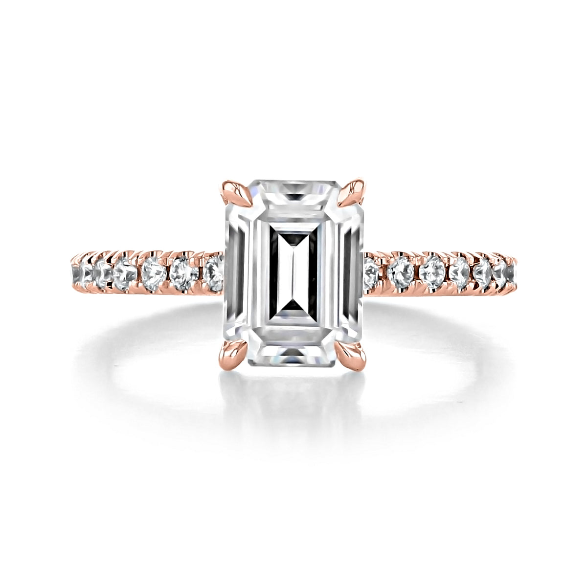 Carthay | Emerald Micro-Prong Engagement Ring featuring a timeless emerald-cut diamond on a rose gold band with a micro-prong pavé setting of small round diamonds.
