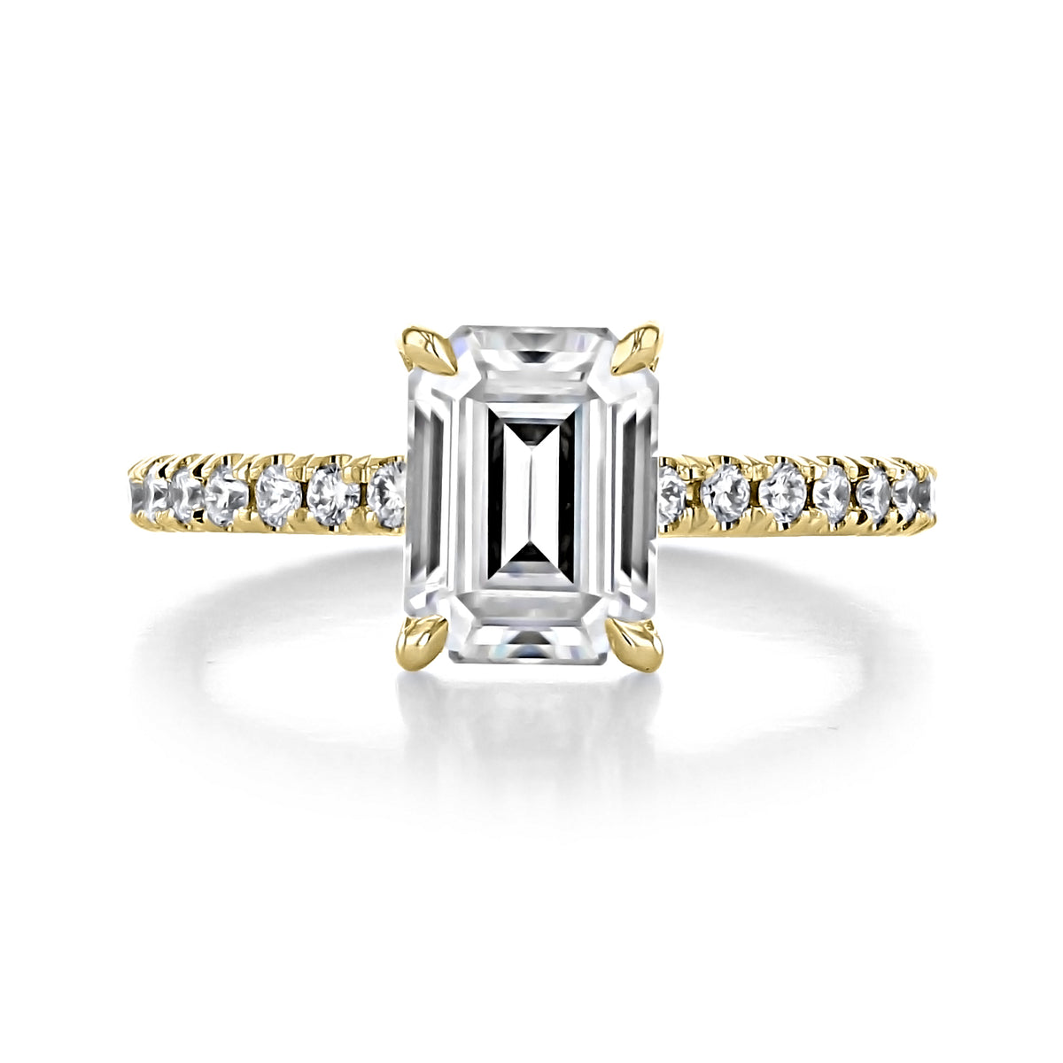 Carthay | Emerald Micro-Prong Engagement Ring in gold with an emerald-cut center stone and a micro-prong set diamond-studded band.