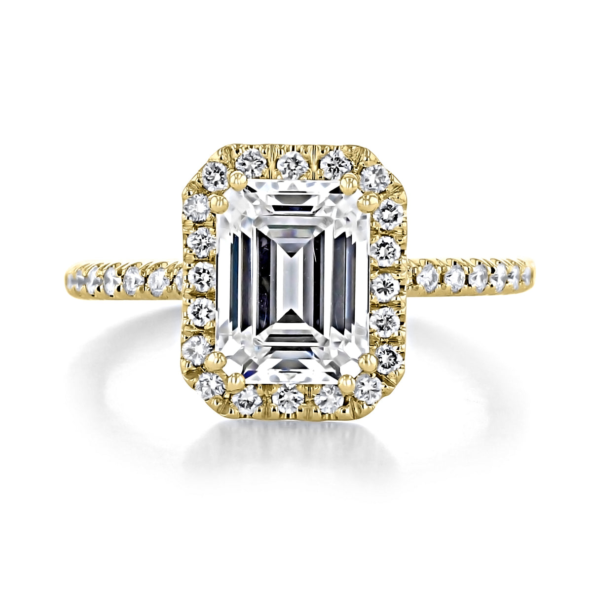 Mae | Emerald Halo Engagement Ring featuring an emerald-cut moissanite in a gold setting with a diamond halo and micro-prong set pavé band.
