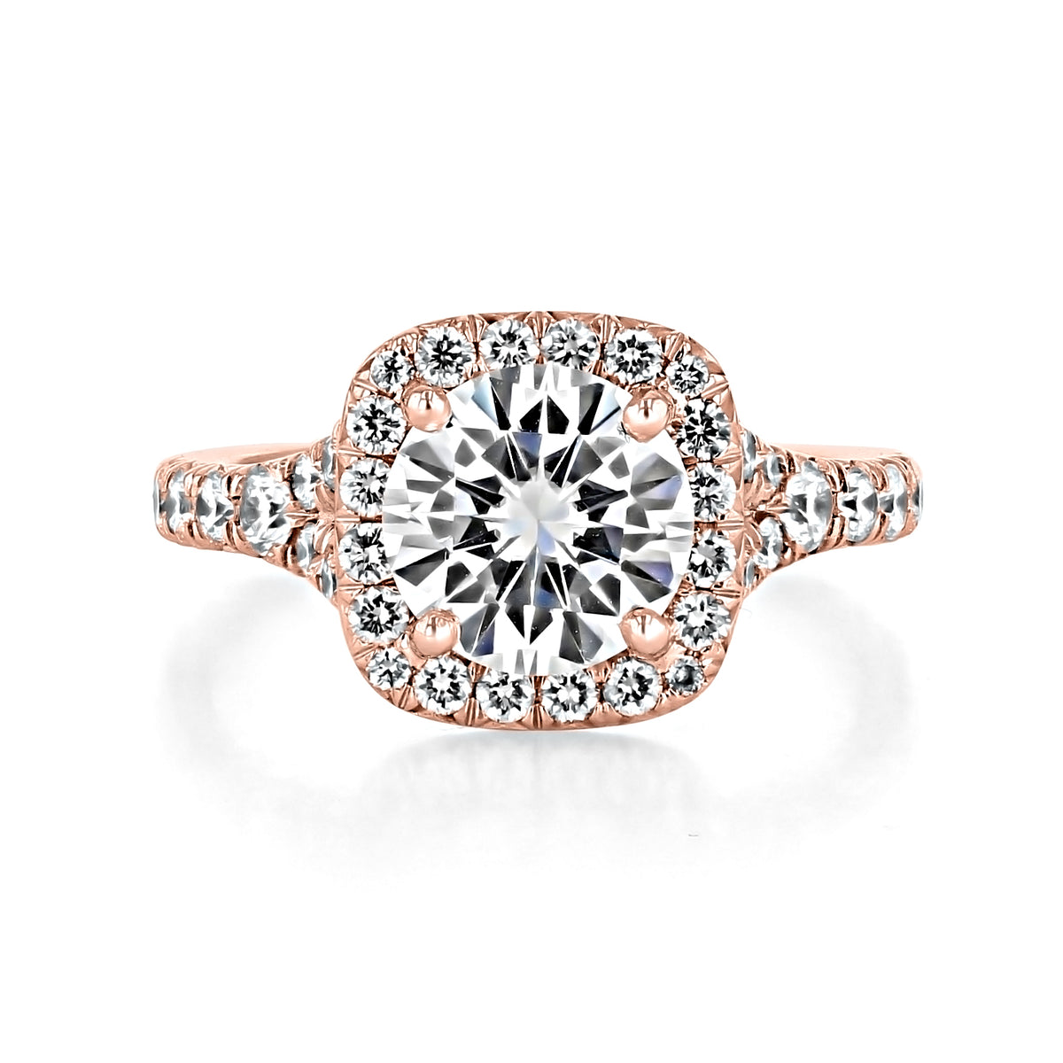 Sonoma | Round Halo Micro-Prong Engagement Ring featuring a round diamond with a cushion-shaped halo and diamonds set along the rose gold band.