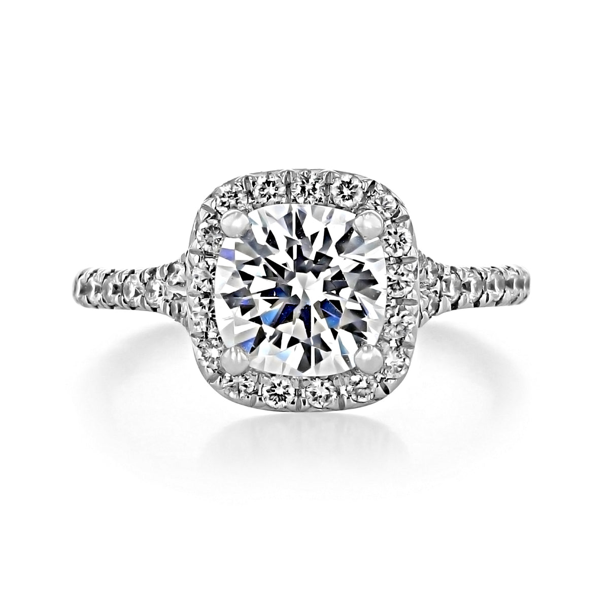 Sonoma | Round Halo Engagement Ring featuring a round diamond, a cushion-shaped halo, and a diamond-encrusted band.