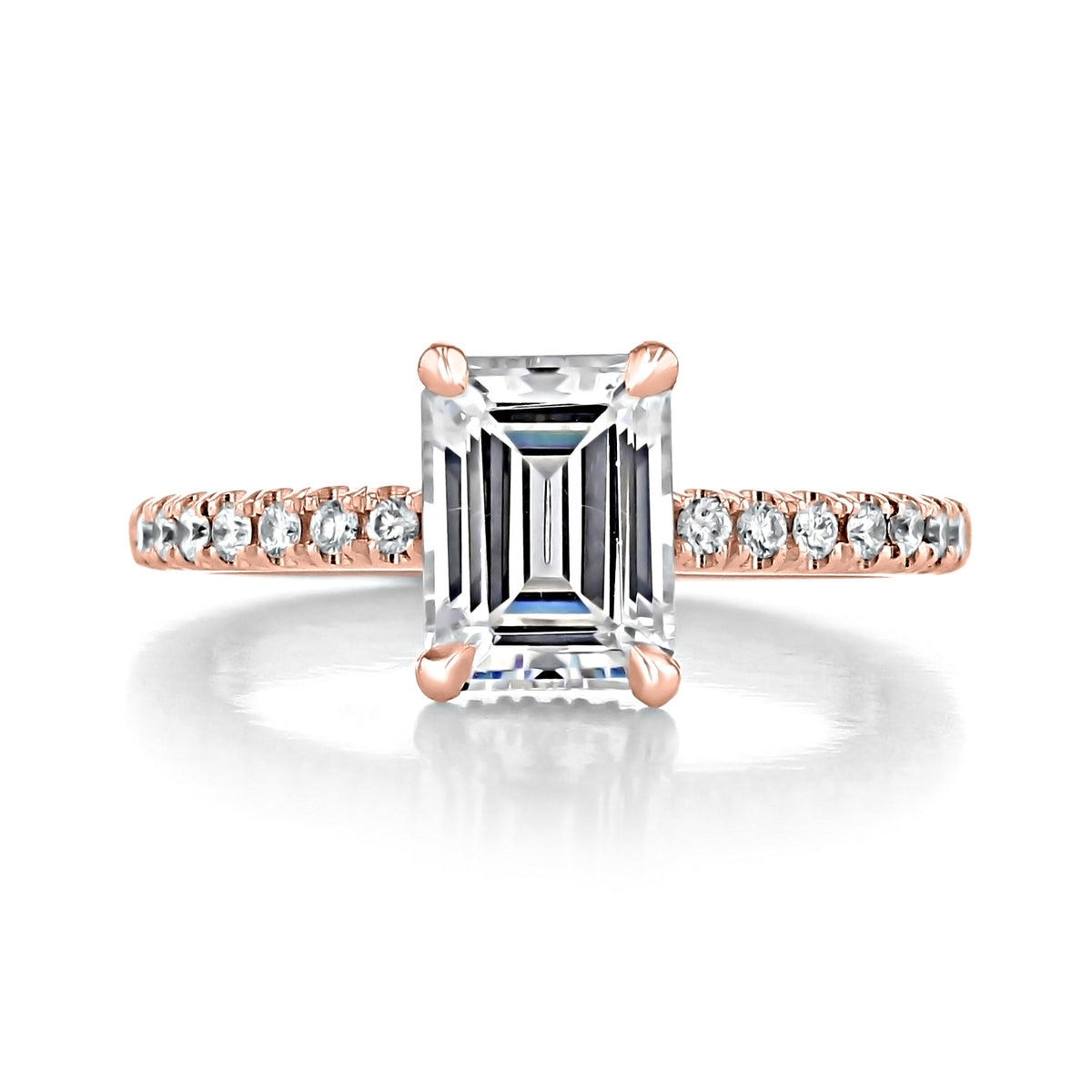 Kiara | Emerald Hidden Halo Engagement Ring featuring an emerald-cut diamond with a pavé-set band and rose gold prongs.