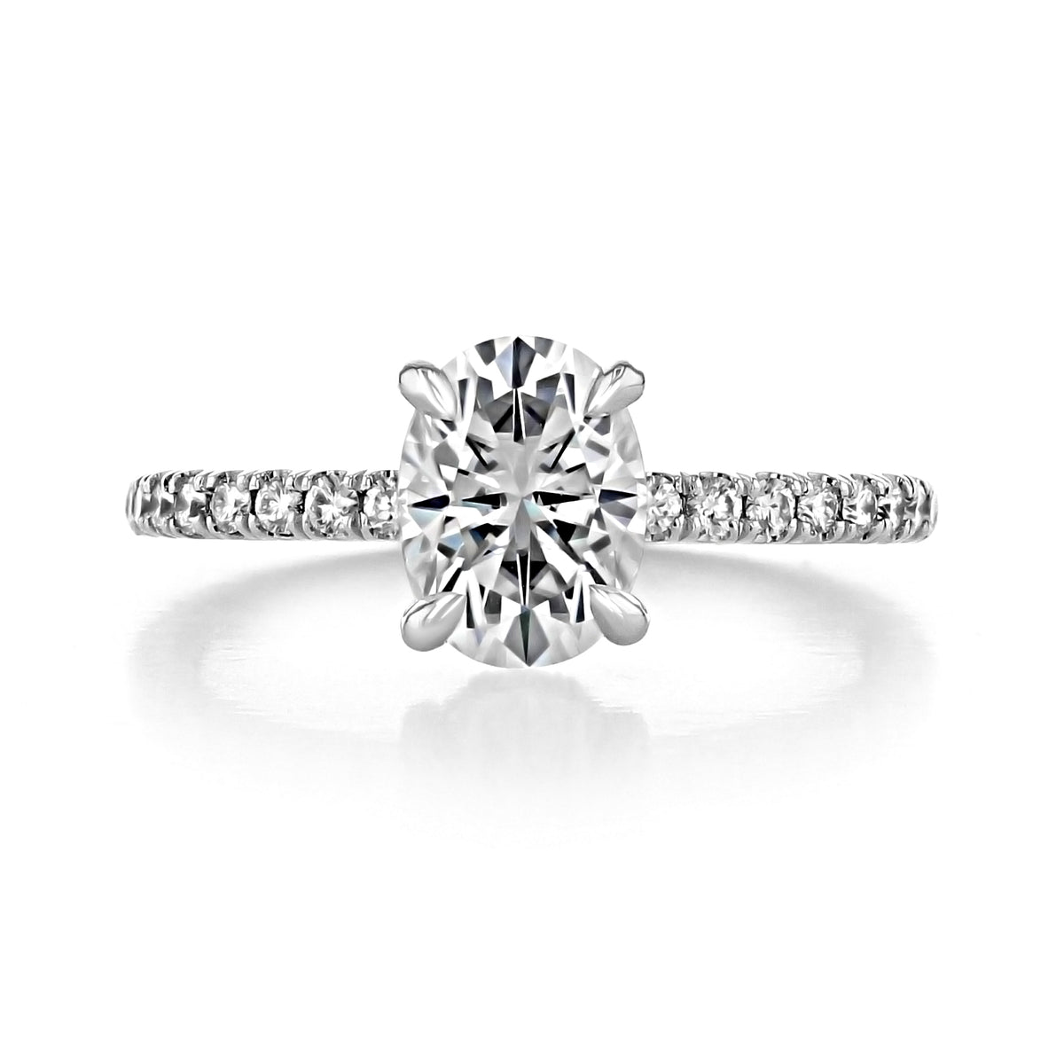 Kiara | Oval Hidden Halo Engagement Ring featuring an oval-cut diamond with a micro-prong set pavé diamond band.