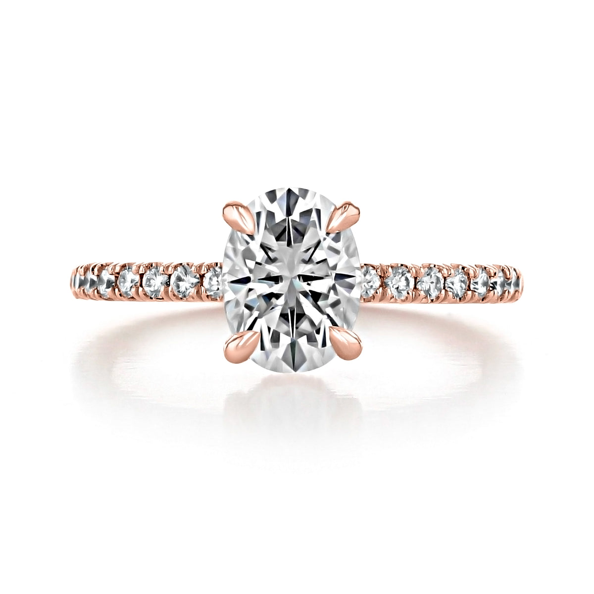 Kiara | Oval Hidden Halo Engagement Ring in rose gold featuring an oval diamond, a diamond-encrusted band, and a hidden halo.