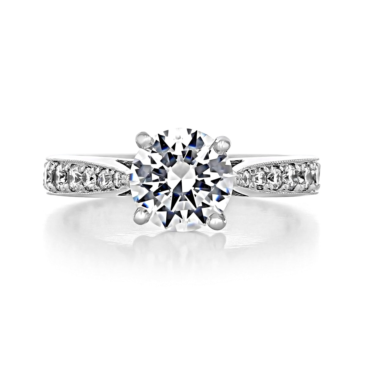 Skylar | Round Pavé Engagement Ring featuring a round brilliant-cut diamond, pavé-set diamond band, and milgrain detailing.