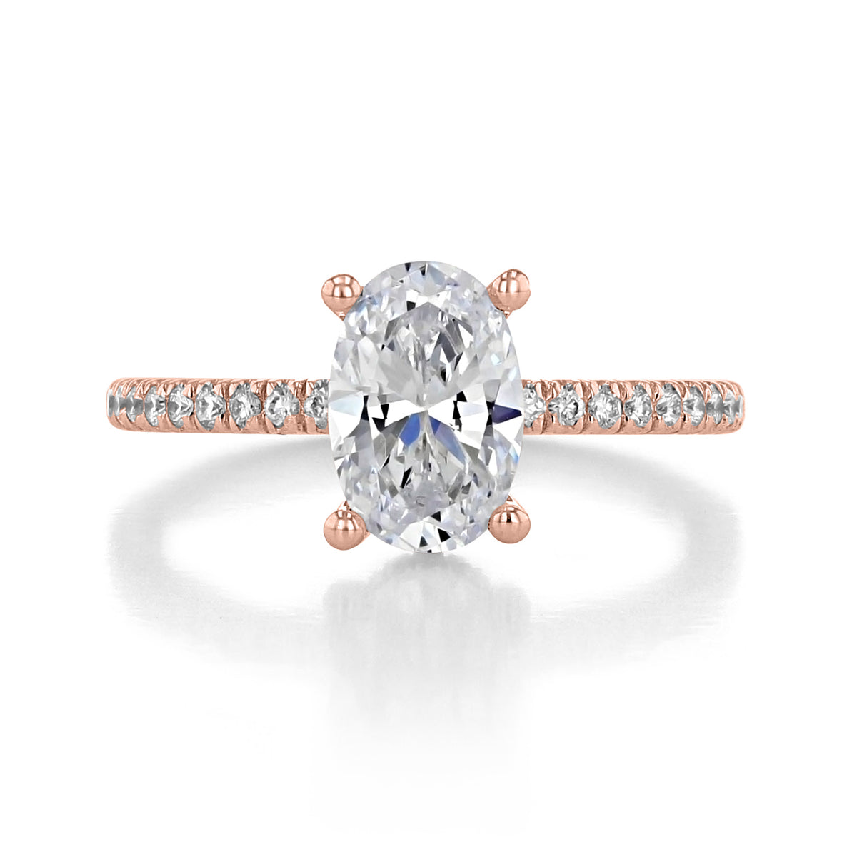 Serenity | Hidden Halo Engagement Ring by Gabriel & Co. featuring an oval-cut solitaire stone, a hidden halo, and a pavé diamond band set in rose gold.