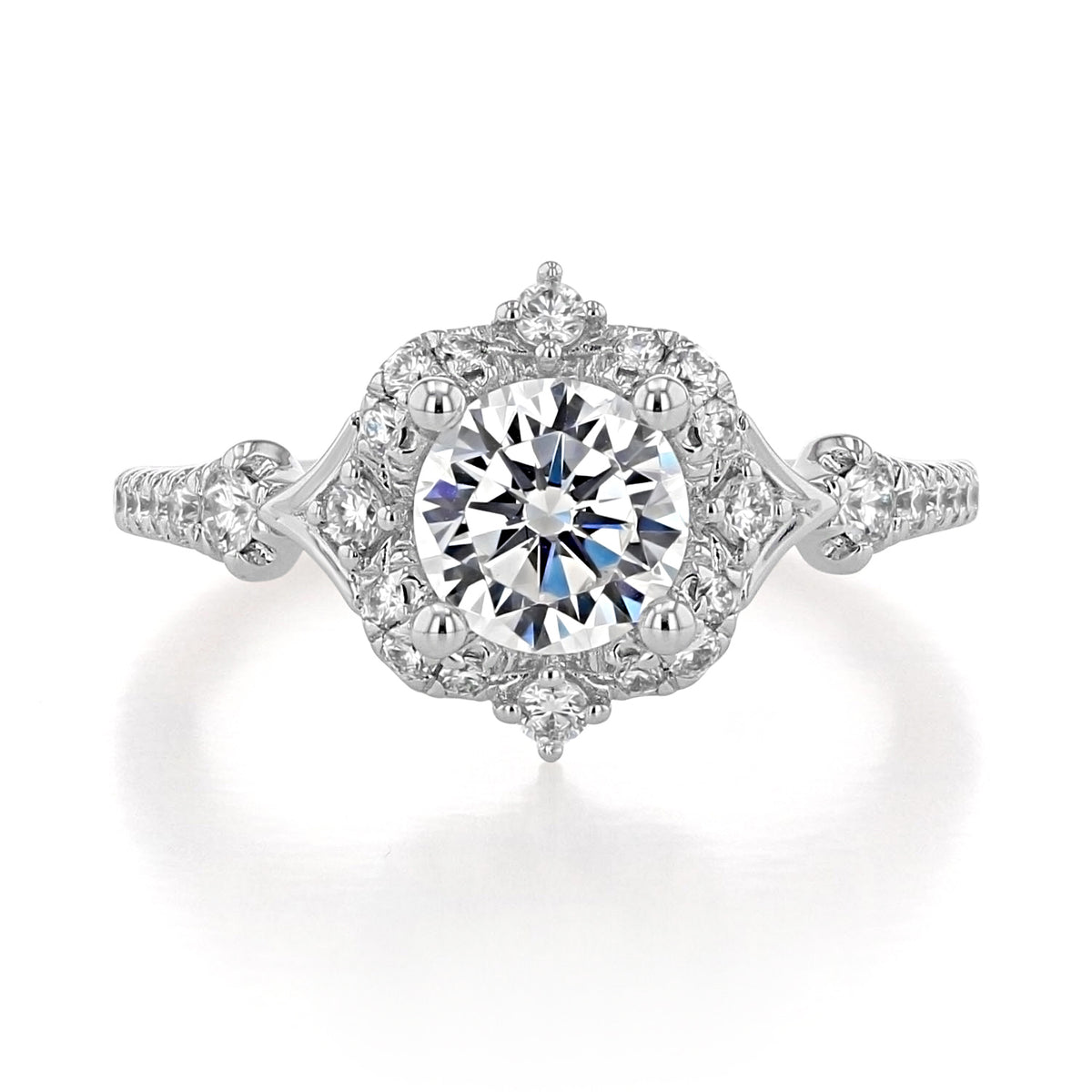 Veronique Halo Engagement Ring by Gabriel & Co. featuring a round-cut diamond, cushion-shaped halo, and diamond-accented band in an antique-inspired design.