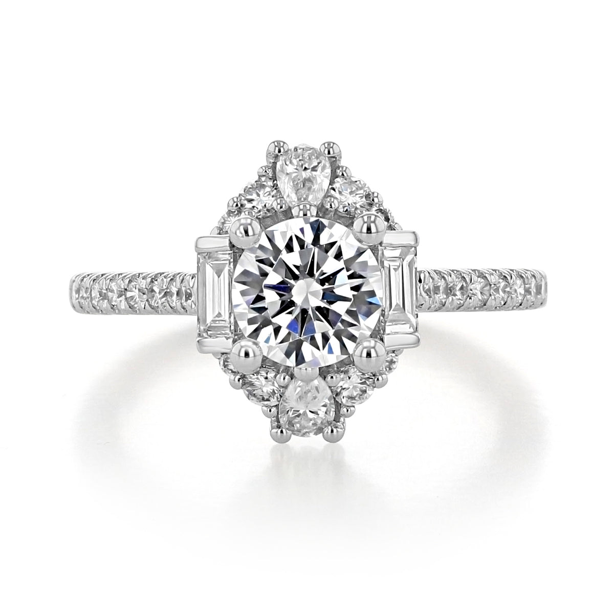 Carrington | Art Deco Engagement Ring by Gabriel & Co. featuring a round diamond center with baguette-cut side stones and a halo of round diamonds on a pavé band.
