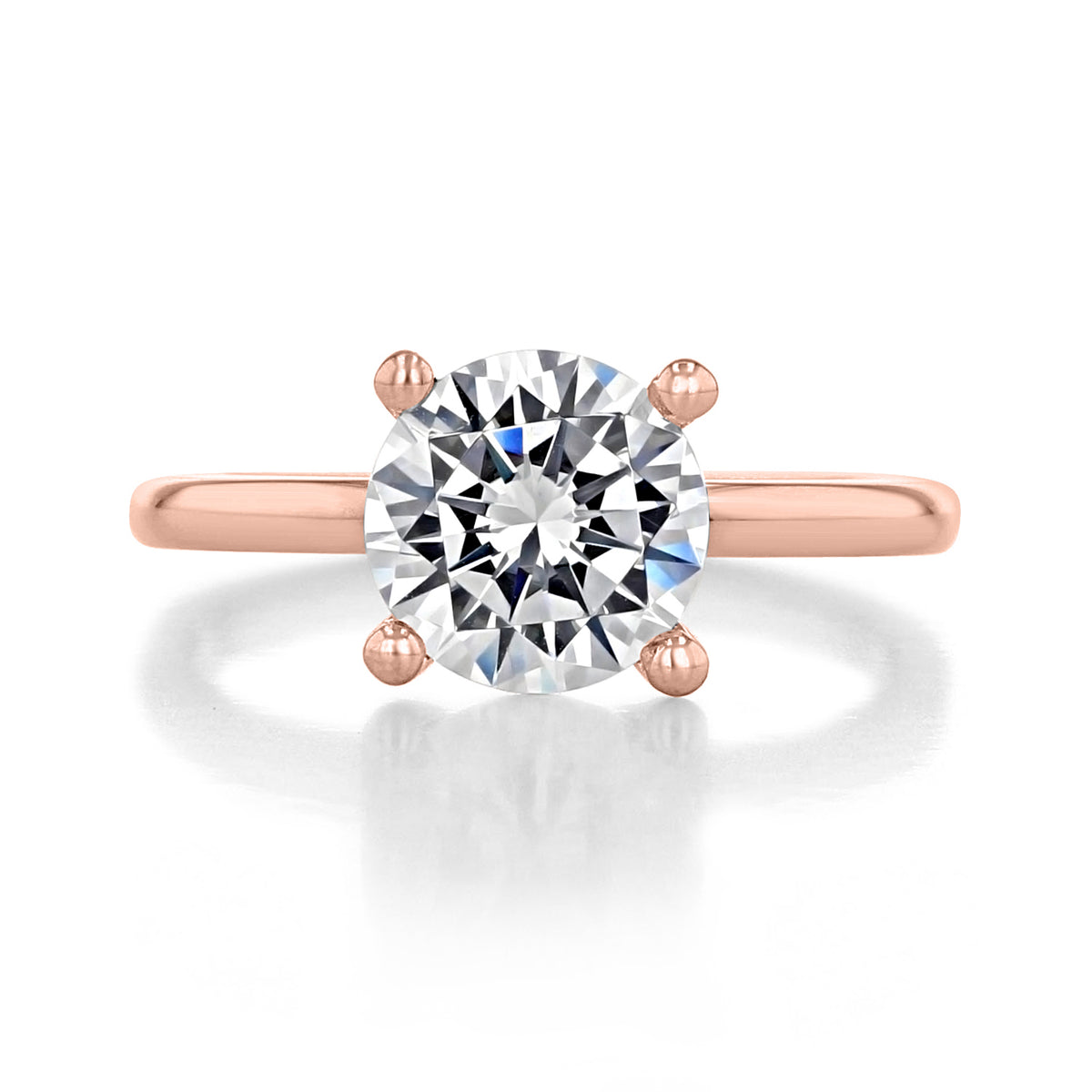 Paula Solitaire Engagement Ring by Gabriel & Co. featuring a round center diamond in rose gold with a four-prong setting.