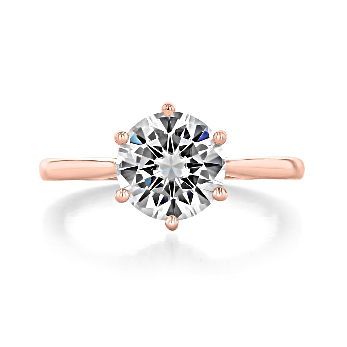 The Juliet | Round 6-Prong Solitaire Engagement Ring by Icing On The Ring features a round brilliant-cut diamond set in a rose gold six-prong basket.