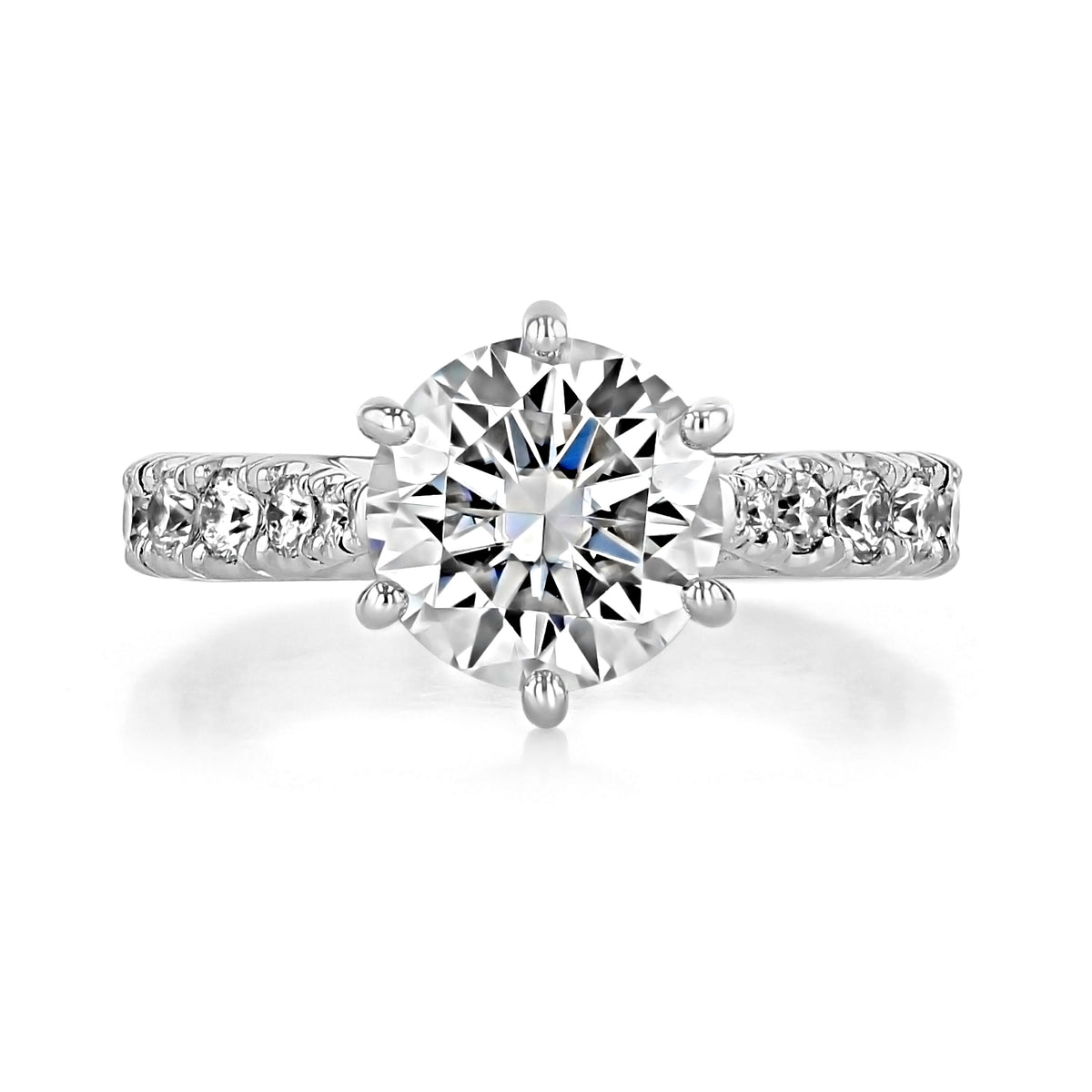 Juliet | Round Micro-Prong Engagement Ring featuring a 2.00 ct. round-cut diamond in a six-prong setting with a micro-prong band accented with small diamonds.