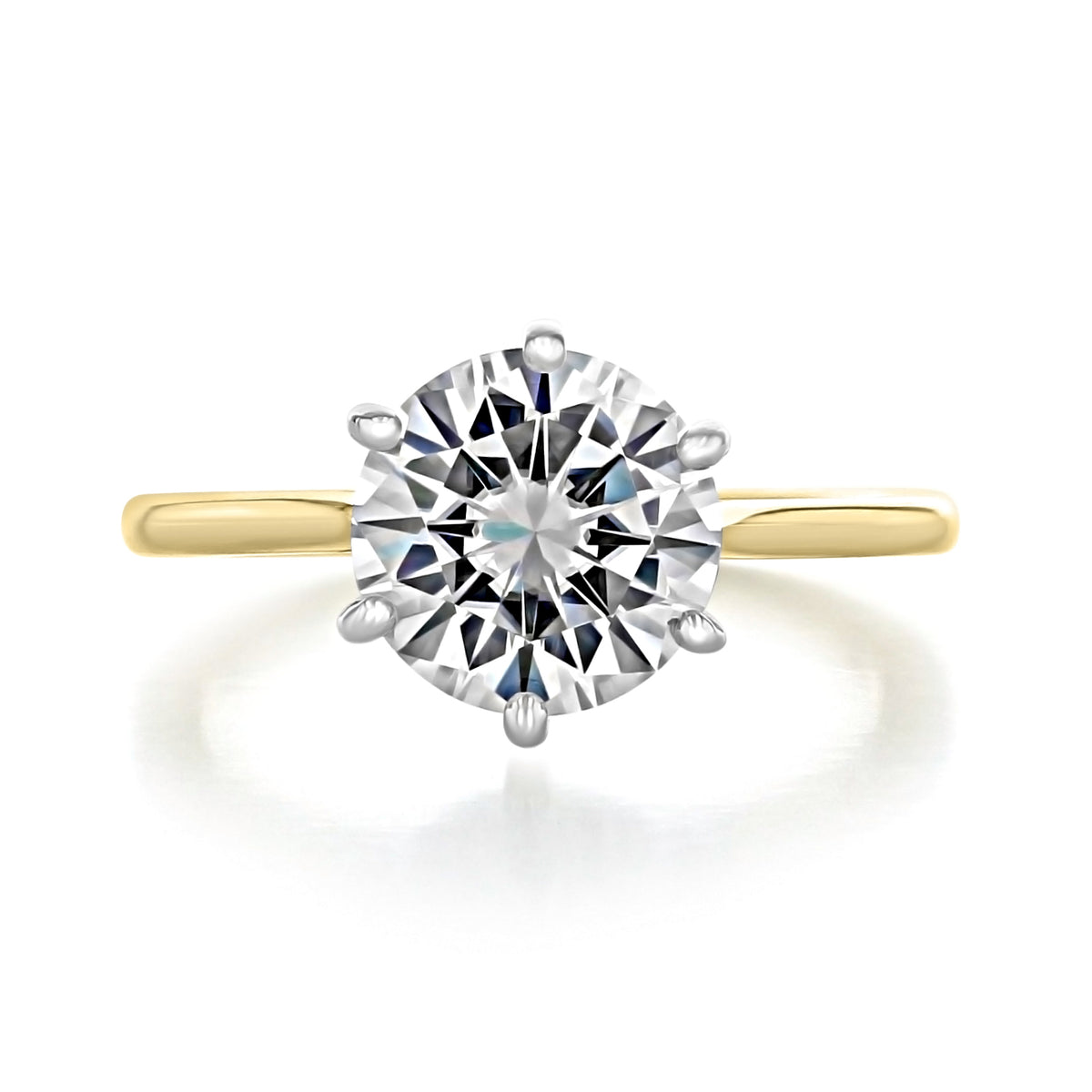 Juliet Round Two-Tone Solitaire Engagement Ring featuring a solitaire diamond, a six-prong white metal setting, and a 14k yellow gold band.