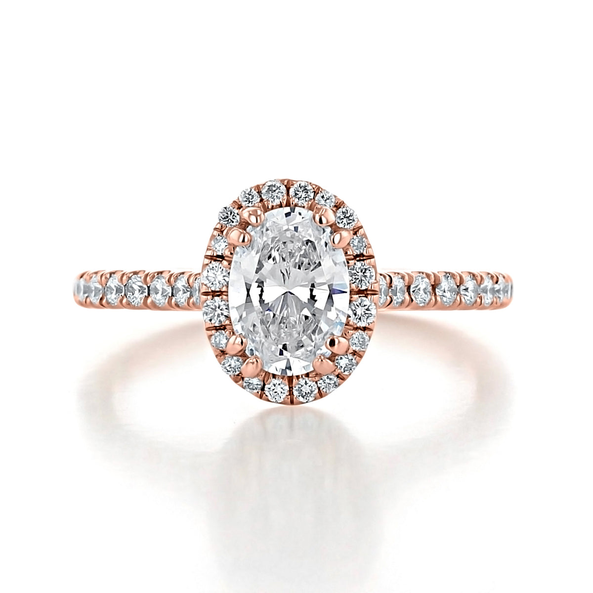Isla | Oval Halo Engagement Ring featuring an oval-cut VS2 clarity diamond with a halo and pavé-set band in a rose gold setting.