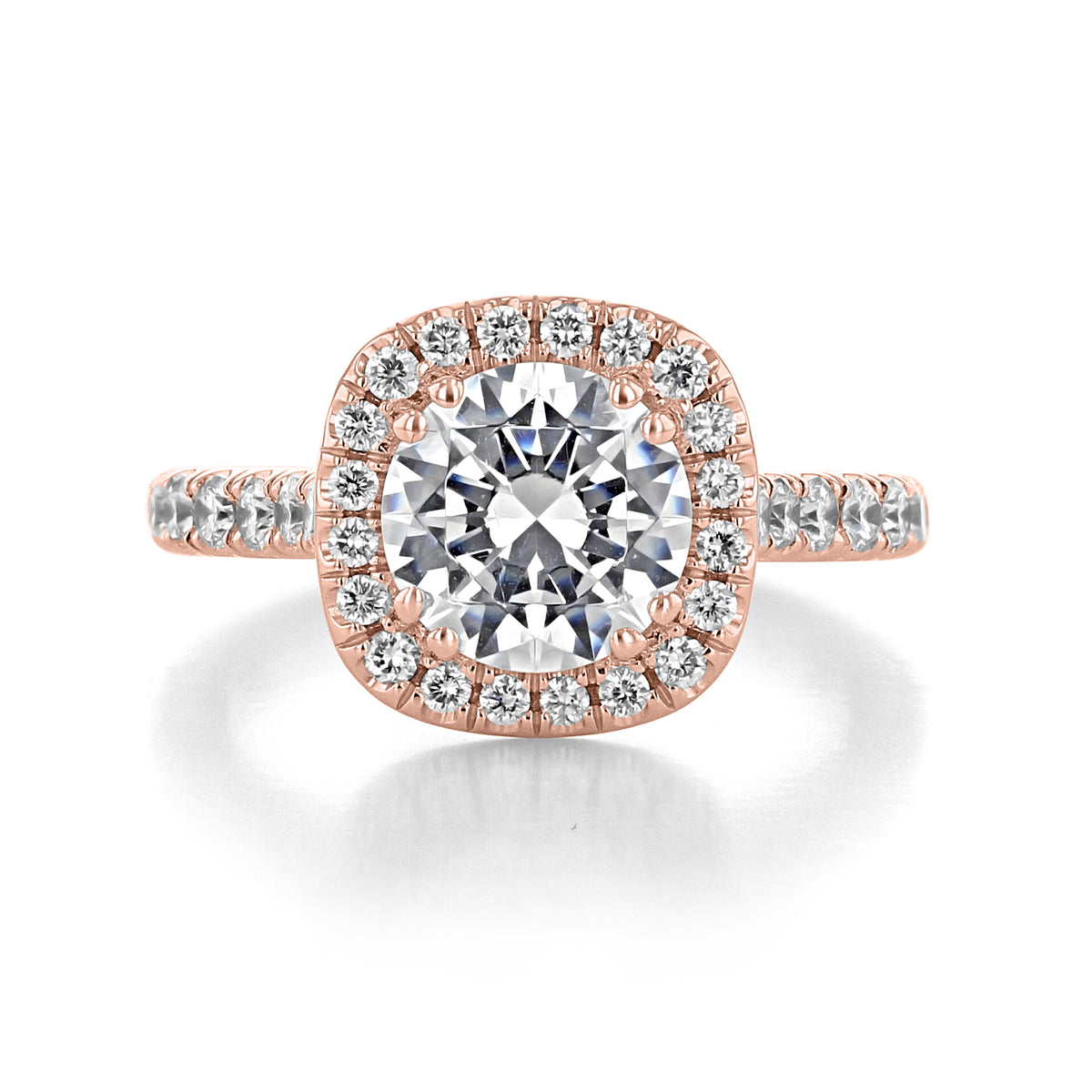 Clarita round halo engagement ring featuring a round diamond in a micro-prong setting on a rose gold band accented with small diamonds.