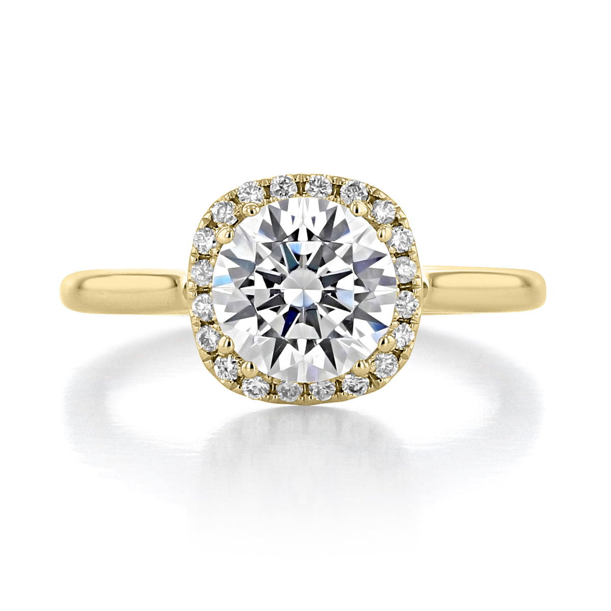 Isla | Round Halo Solitaire Engagement Ring featuring a round center diamond with a halo of small diamonds set in a 14k yellow gold band by evertrue by Icing On The Ring.