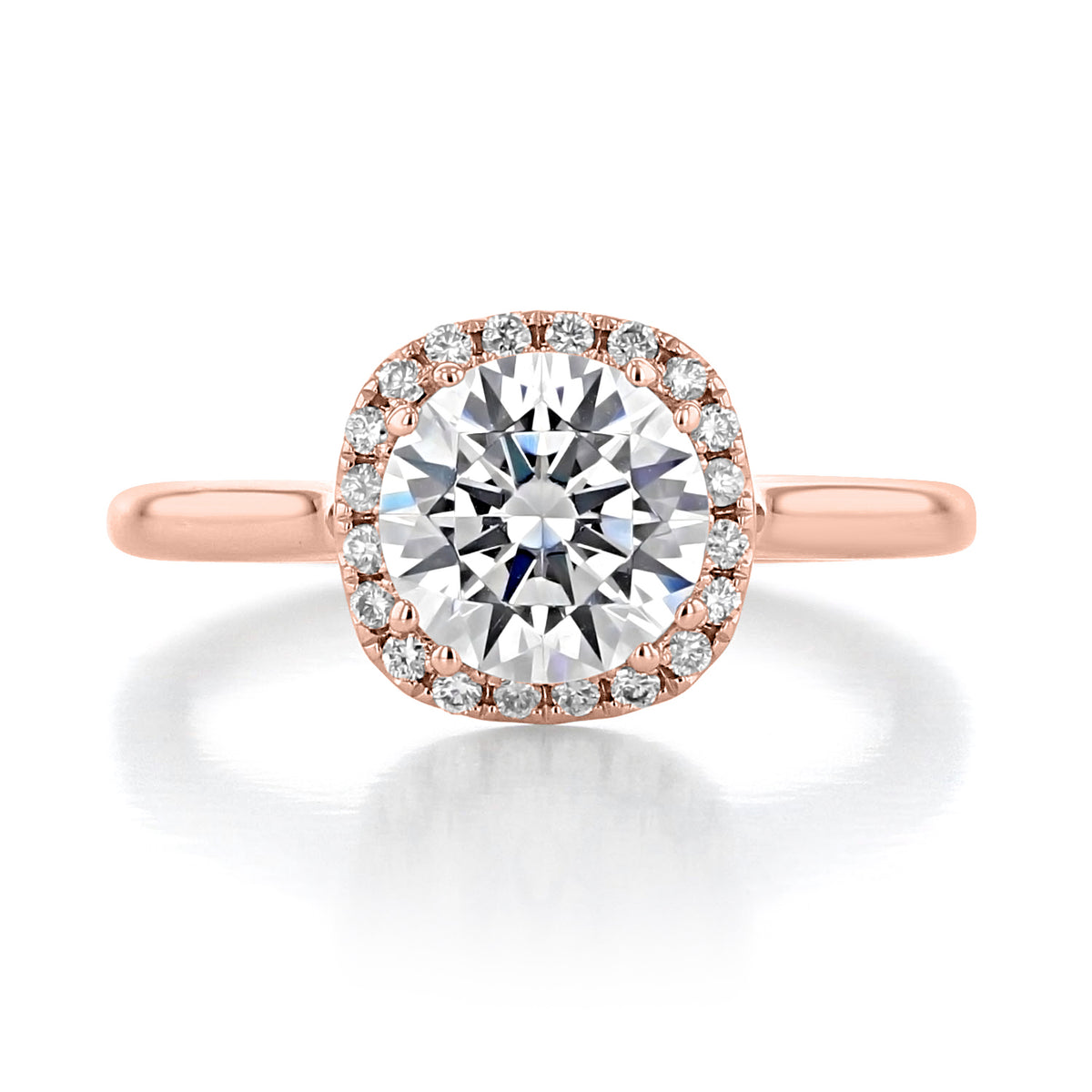 Isla | Round Halo Solitaire Engagement Ring in 14k rose gold, featuring a round center stone surrounded by a halo of small pavé diamonds.
