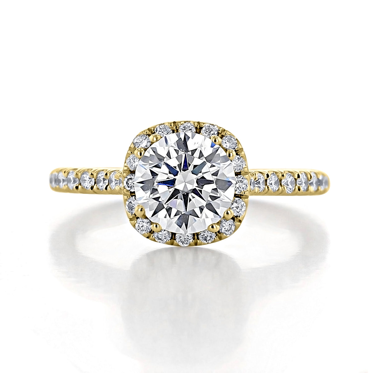 Isla | Round Halo Engagement Ring featuring a round center diamond, a halo setting, and micro-prong-set diamonds along the yellow gold band.