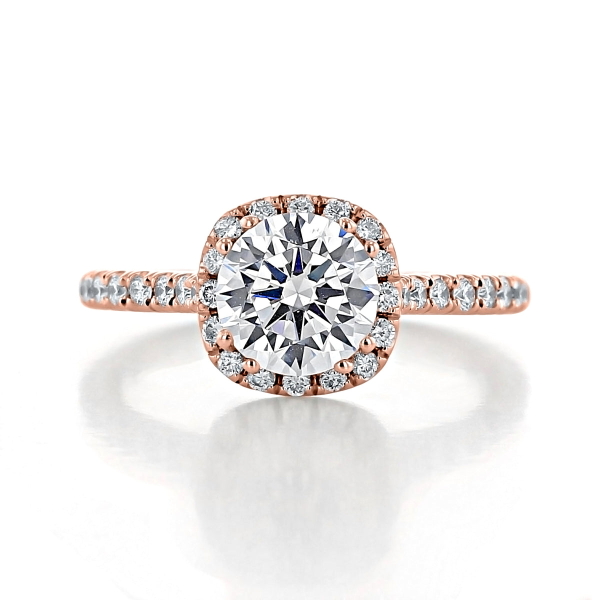 Isla | Round Halo Engagement Ring in rose gold featuring an Evertrue diamond center stone surrounded by a halo of spotlight diamonds on a pavé band.