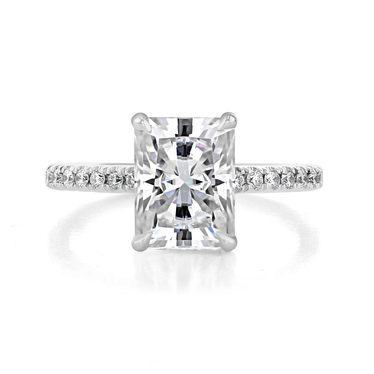 Broadway | Radiant Micro-Prong Engagement Ring featuring a radiant-cut diamond in a secure four-prong setting on a diamond-accented band.