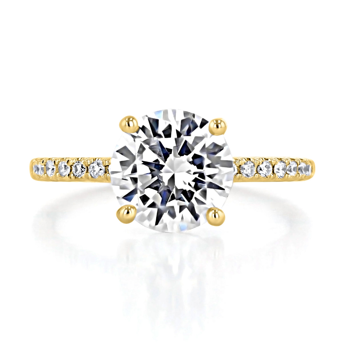 Melrose | Round Micro-Prong Engagement Ring featuring a round-cut diamond on a yellow gold band with a micro-prong design accented with smaller diamonds.