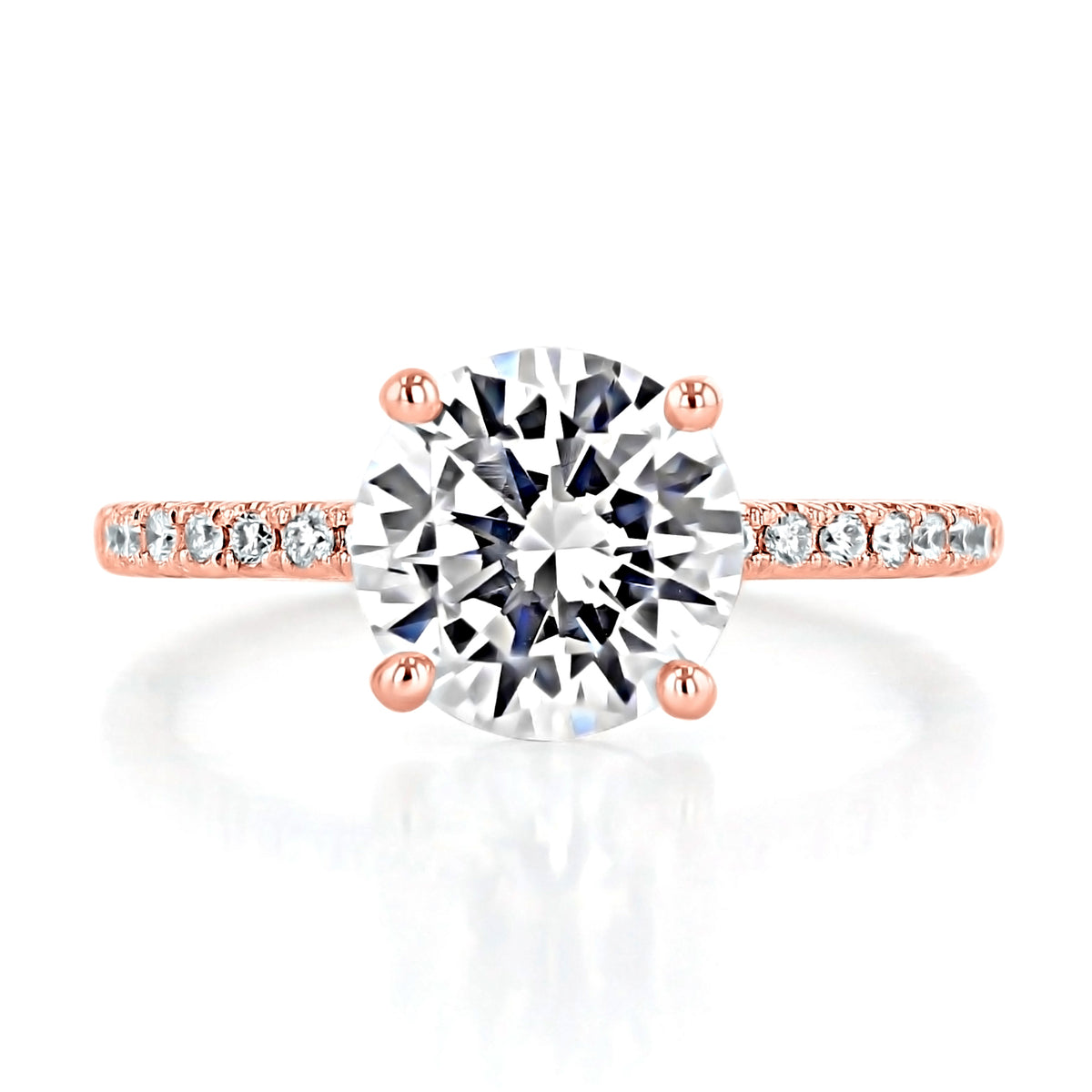 Melrose Round Micro-Prong Engagement Ring featuring a round solitaire diamond on a rose gold micro-prong diamond pavé band.