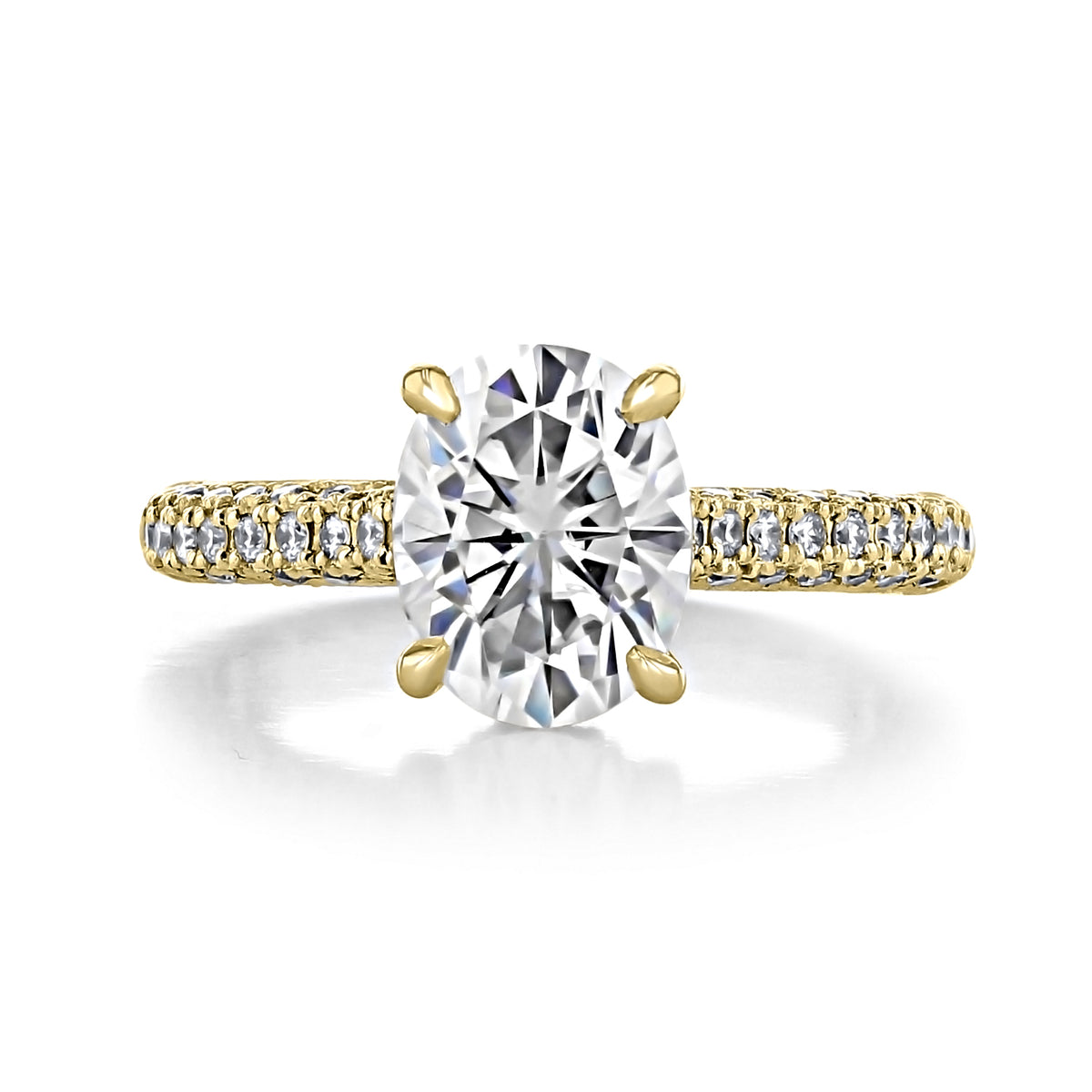 Marilyn | Oval Triple Pavé Engagement Ring featuring an oval-cut diamond on a yellow gold band with three rows of pavé-set diamonds and a hidden halo.
