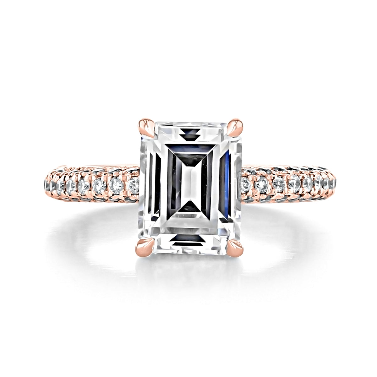 Elena Emerald Triple Pavé Engagement Ring featuring an emerald-cut diamond with a pavé band on a rose gold setting and a hidden halo.