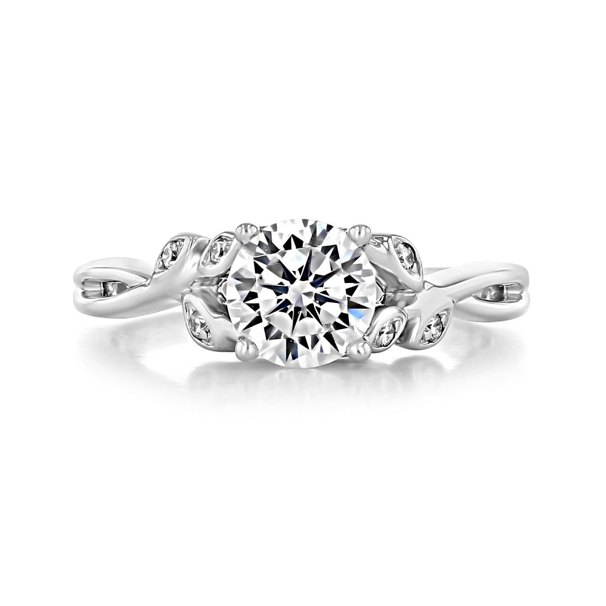 Ivy | Round Floral Diamond Engagement Ring featuring a 1-carat round diamond on a nature-inspired twisted band with leaf-shaped accents set with small diamonds.