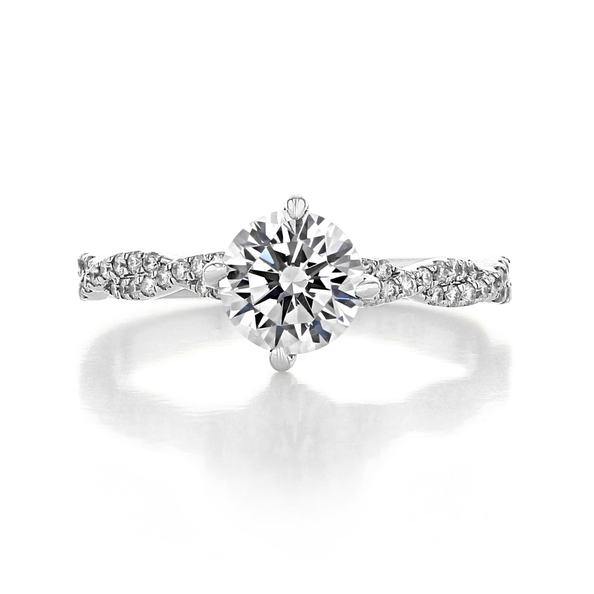 Aurora | Round Twist Engagement Ring featuring a round-cut diamond in an East-West prong setting with a pavé-set twisted band.