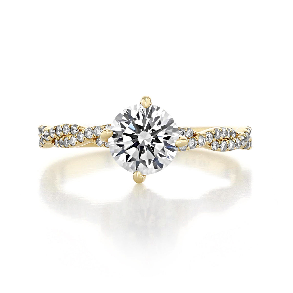 Aurora | Round Twist Engagement Ring featuring a gold band with a round center stone in an East-West prong setting atop a twisted pavé diamond band.