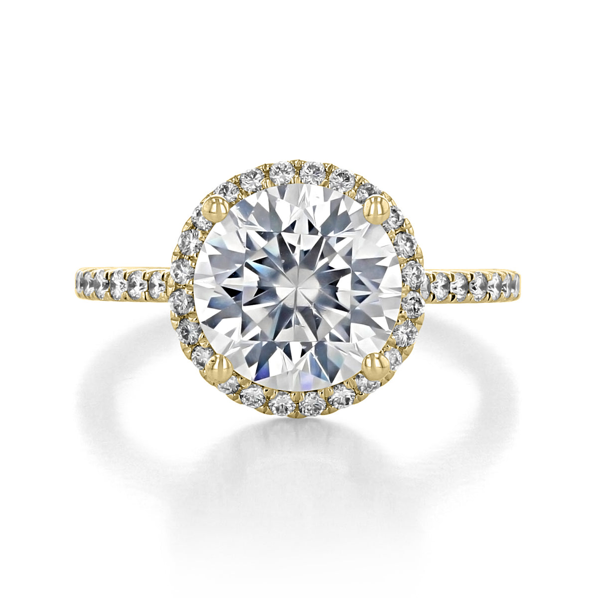Ora | Round Halo Engagement Ring featuring a round-cut diamond halo with micro-prong diamonds on a yellow gold band.