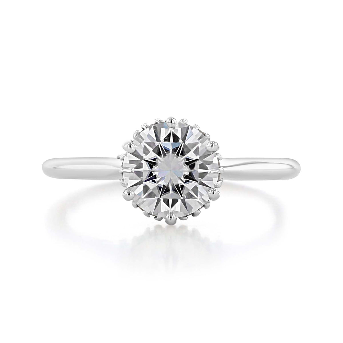 Waverly | Round 6-Prong Solitaire Engagement Ring featuring a round-cut solitaire diamond in a six-prong setting on a plain platinum band.