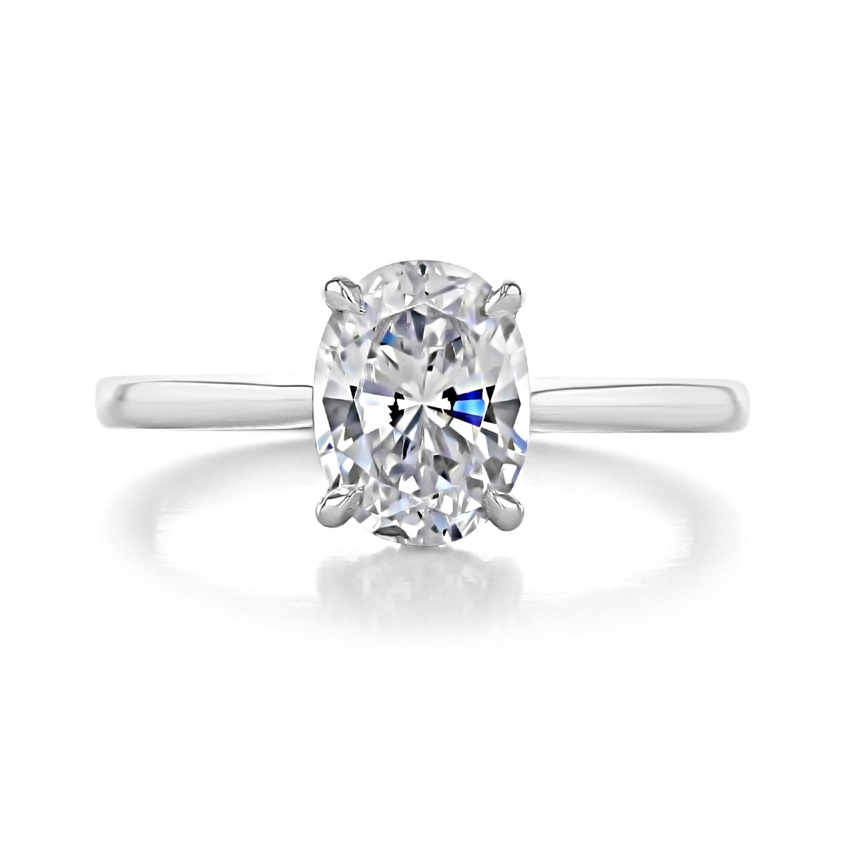 Waverly Oval Solitaire Engagement Ring featuring an oval diamond on a plain metal band.