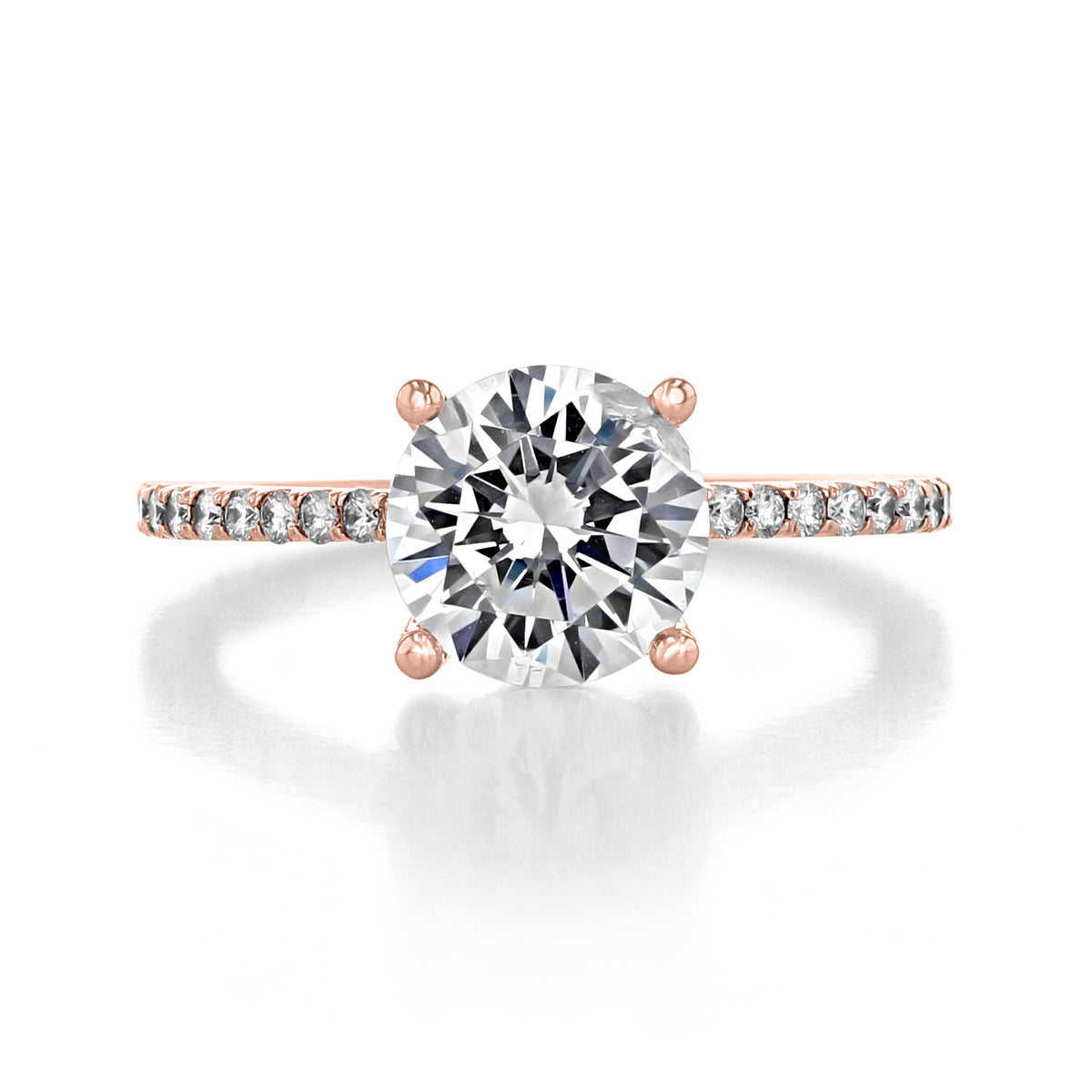 Lucerne round micro-prong engagement ring featuring a round diamond solitaire set in rose gold with a micro-prong pavé band.
