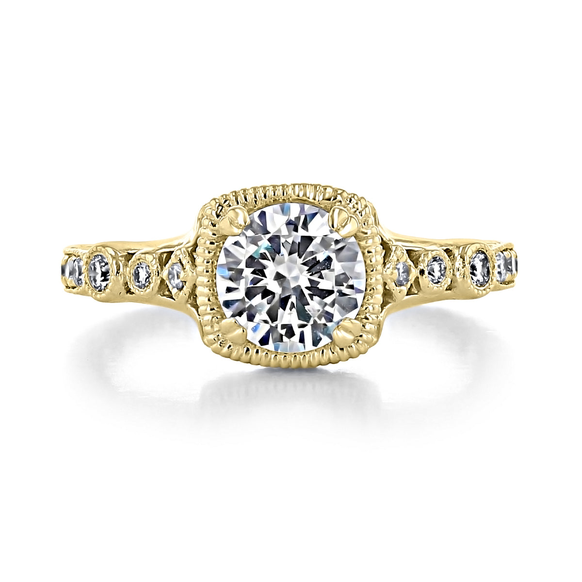 Victoria | Round Engraved Pave Engagement Ring by Gabriel & Co. in gold with a round-cut center stone in a milgrain-edged square setting, featuring scroll engraving and pavé-set diamonds along the band.