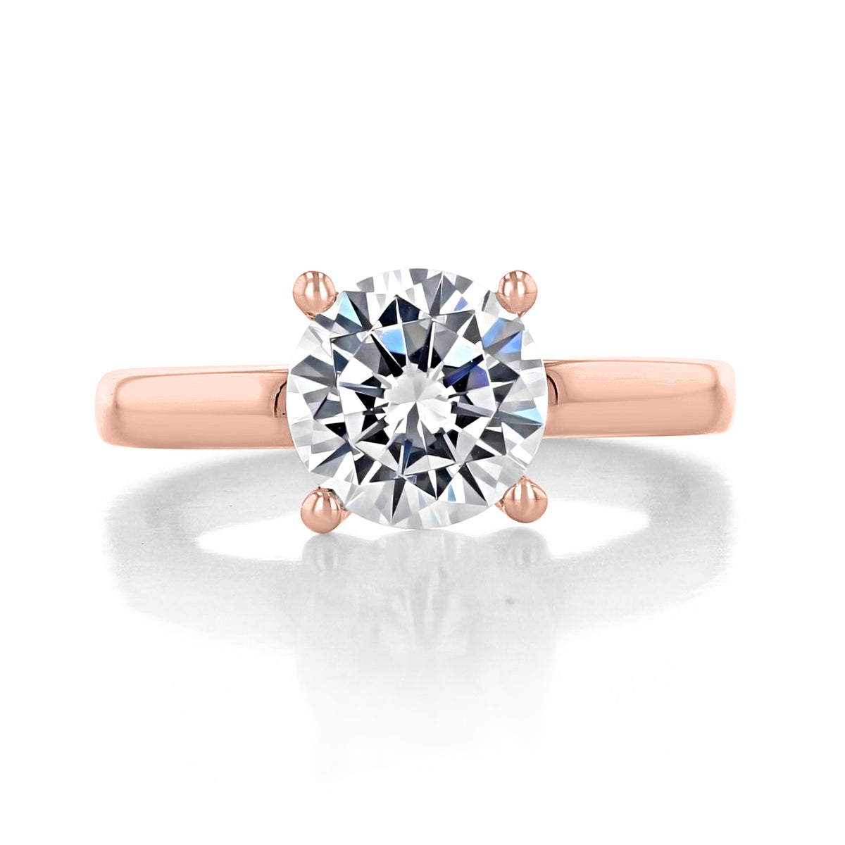 Cambria | Round Solitaire Engagement Ring by Gabriel & Co. featuring a round-cut diamond in a four-prong rose gold band.