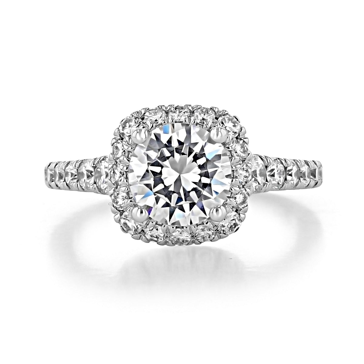 Hazel Halo Engagement Ring by Gabriel & Co. featuring a round brilliant-cut diamond with a diamond halo and pavé-set diamond band.
