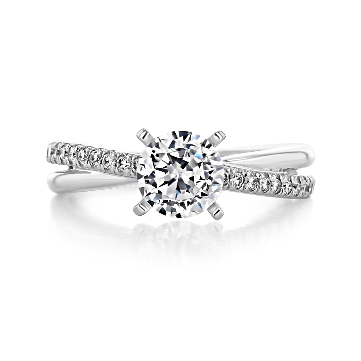 Morgan | Micro-Prong Engagement Ring by Gabriel & Co. featuring a round center stone in four prongs on a crisscross band accented with small pavé diamonds.