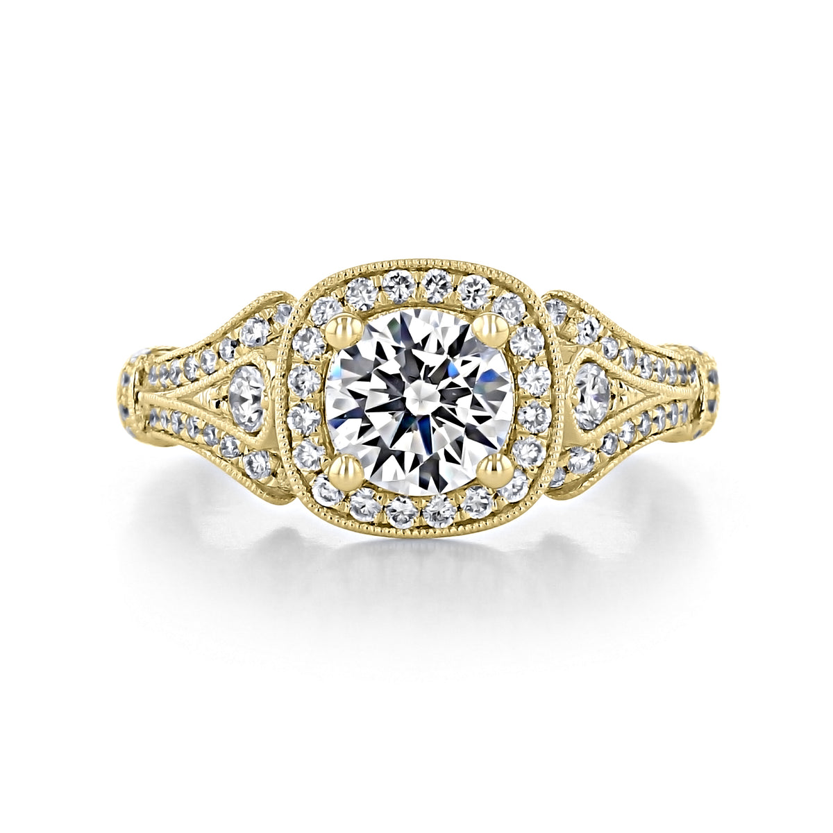 Delilah Halo Engagement Ring by Gabriel & Co. in yellow gold, featuring a round center stone with pavé diamond accents along the cushion halo and split shank.