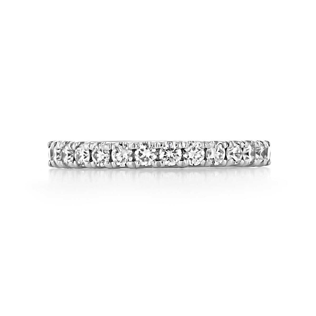 The Tacori Petite Crescent | Diamond Band - HT254525B12W is a delicate eternity band featuring a continuous row of round brilliant diamonds set in white metal, symbolizing eternal love.